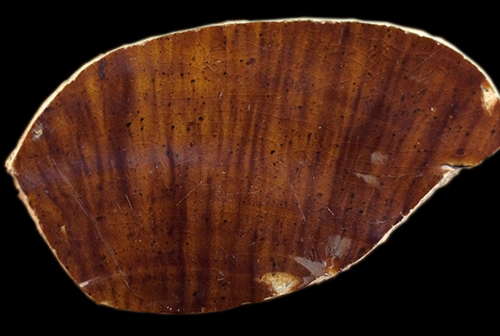 Bulbous bodied hollow vessel, possibly jug.  The top photograph is the vessel exterior, showing a spotted effect and the bottom photograph is the interior glazing of the same vessel, with a more streaked appearance - Collected by George L. Miller in 1986 in Staffordshire in Hanley.  Cannot be attributed to a specific pottery.